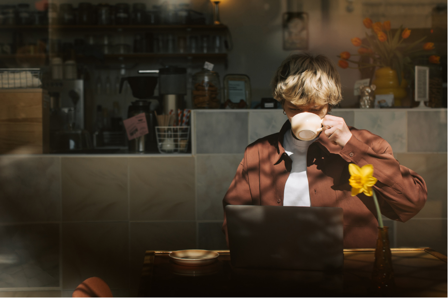 A creative professional working in a warm, cinematic studio